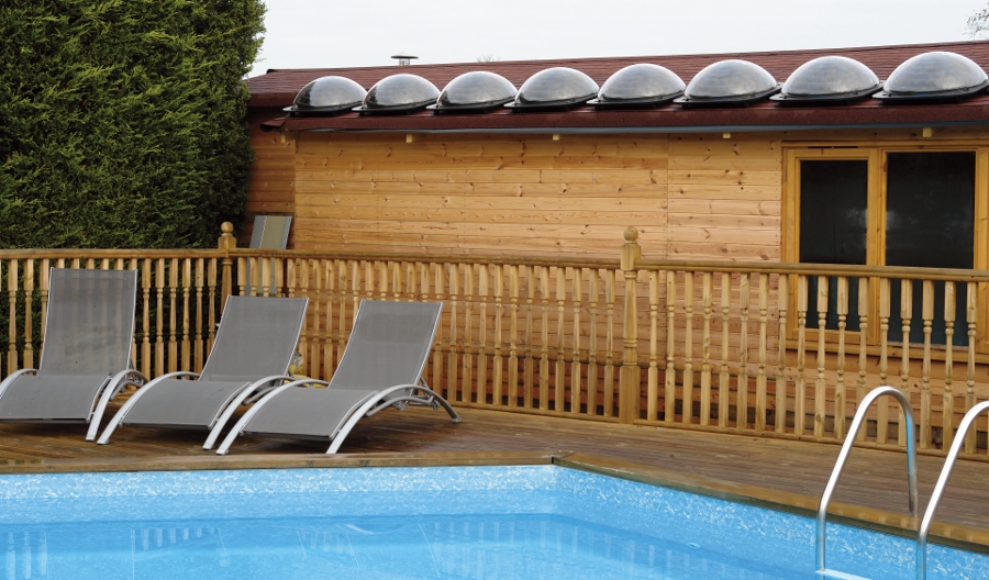 swimming pool solar heat pod in line on roof